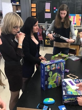 Two people observing a STEAM activity