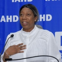 Woman speaking at a fundraiser at the podium