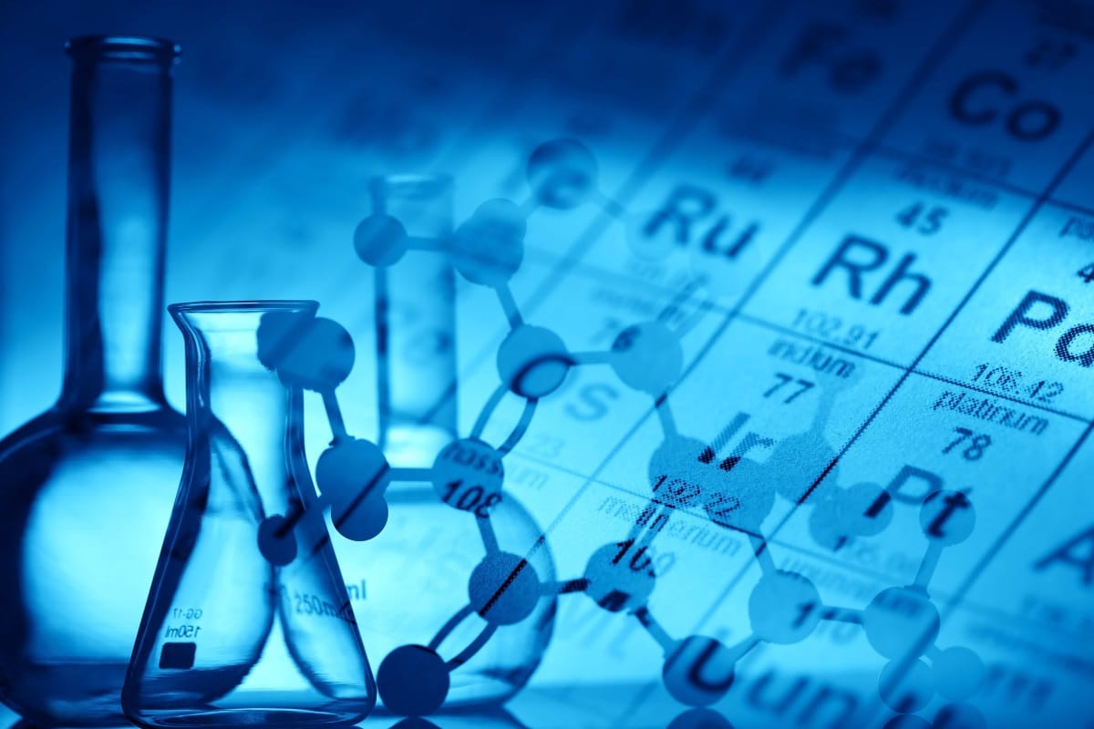 Chemistry lab equipment, periodic table and compound elements