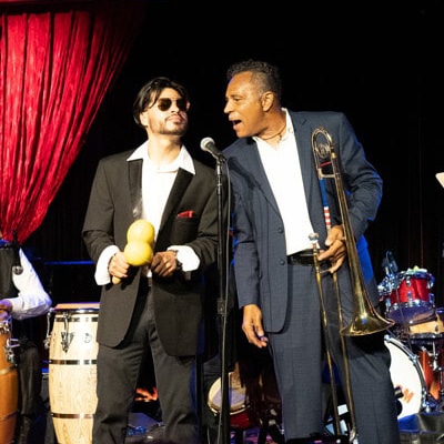 Jose Trombone Latin Band on stage playing music
